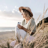 VONMÄHLEN Backbone Secure Minimalist Phone Finger Strap Grip Holder white being held in fingers outdoors