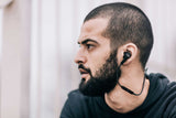 man wearing Bang & Olufsen Beoplay H5 Splash and Dust Proof Wireless Earphones